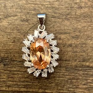 5/$25 pendant with diamonds and yellowish orange stone